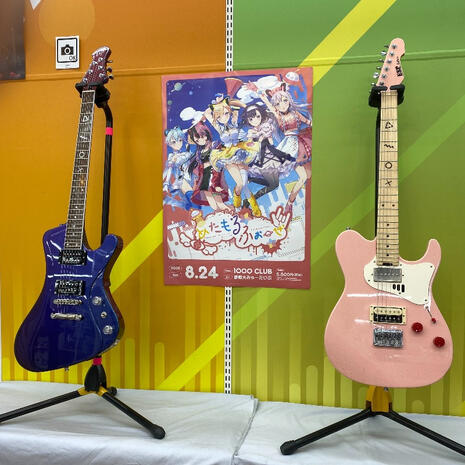 Nonoka and Ritsu&#39;s guitars as part fo the Bandori ESP guitar exhibition in Akihabara Gamers