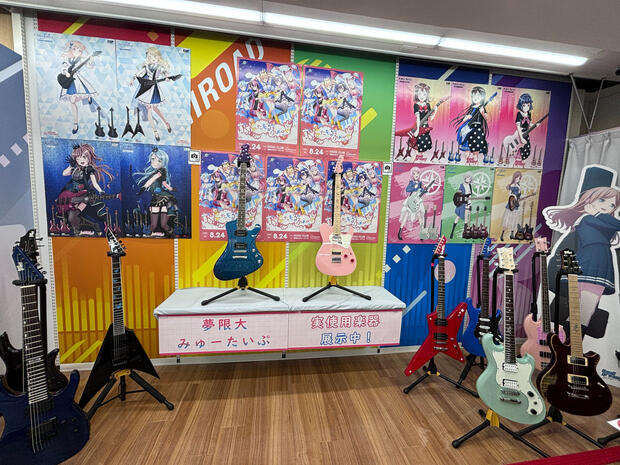 Nonoka and Ritsu&#39;s guitars as part fo the Bandori ESP guitar exhibition in Akihabara Gamers