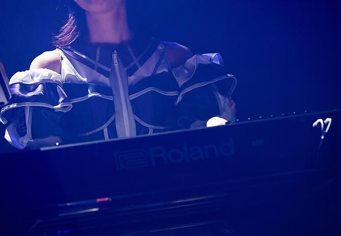 Miyako playing the kayboard from the official concert photos