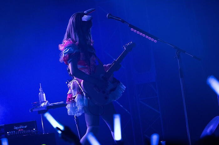 Nonoka playing the guitar from the official concert photos