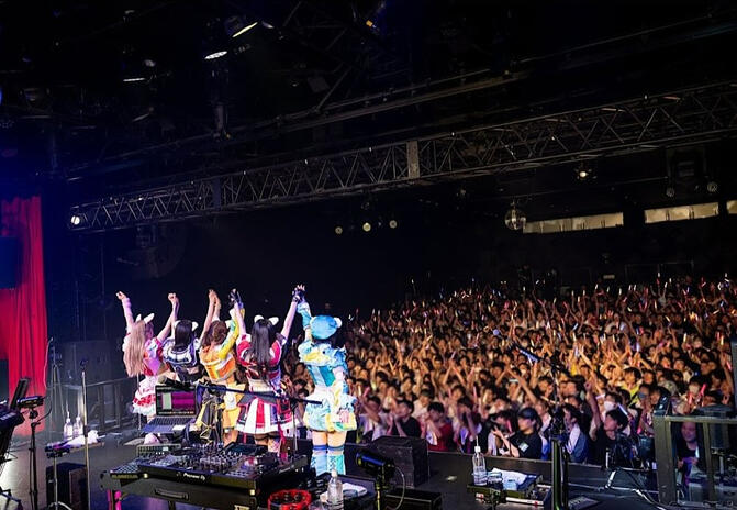 Picture of the band doing their post performance bow from the official concert photos