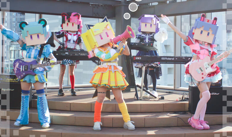 Newtype wa Virtual Yume wo Miru ka? digital single cover with the real life band in their stage outfits and pixel heads